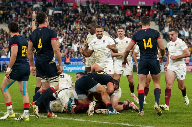 England players celebrate after beating Argentina