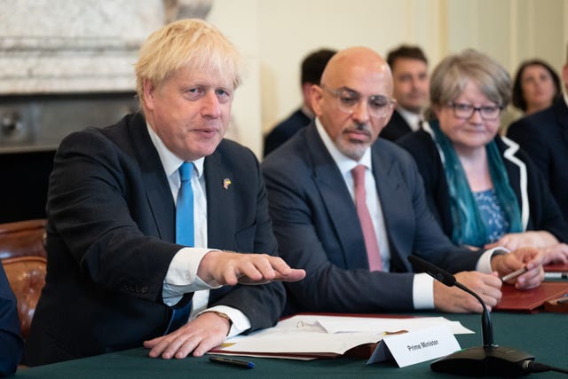 Mr Zahawi sits next to Boris Johnson during a Cabinet meeting while he was chancellor (PA)