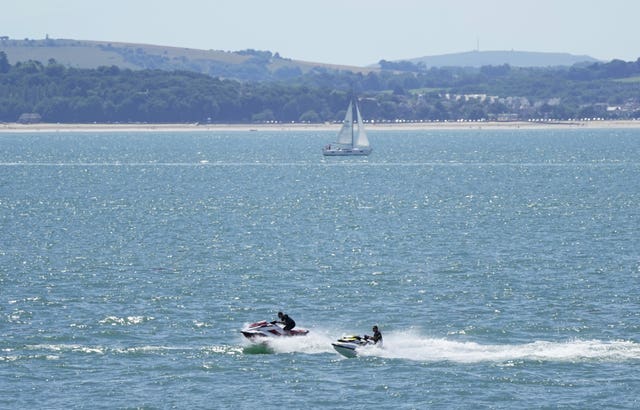 People jet ski in the Solent near to Southsea in Hampshire 