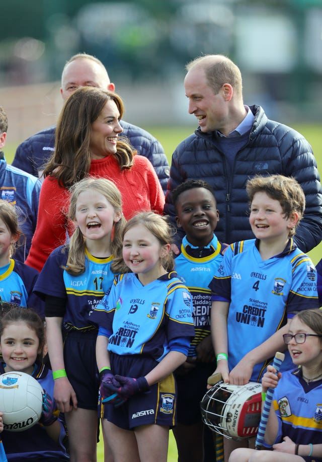 The Duke and Duchess of Cambridge pose for a group photograph 