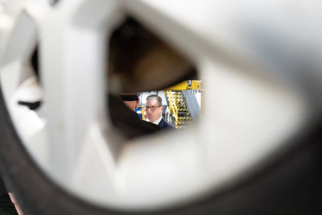 Labour Party leader Sir Keir Starmer seen through a wheel during a visit to Grimsby Institute