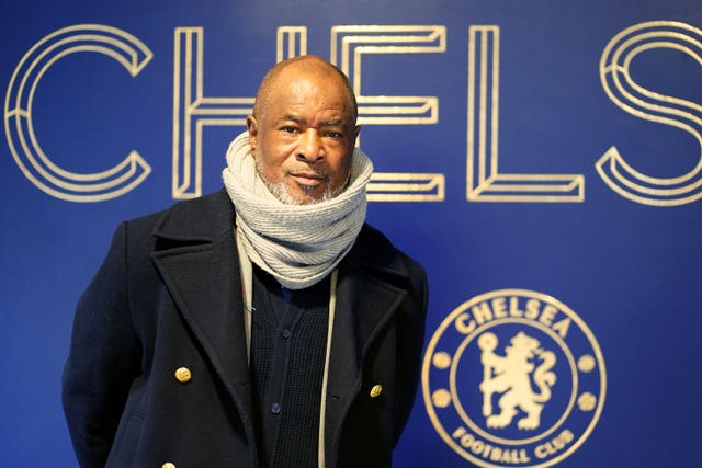 Paul Canoville poses next to a Chelsea sign