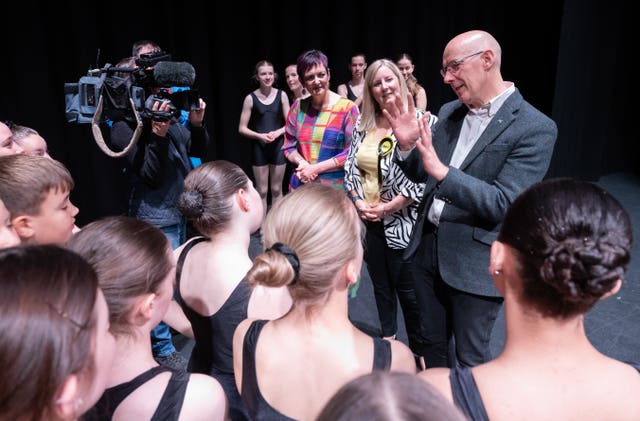 First Minister John Swinney speaks to dancers during a visit to the Reconnect Howden Park Centre in Livingston