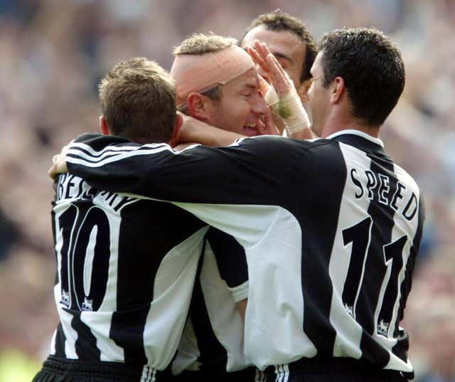 Newcastle captain Alan Shearer (centre) is congratulated by team-mates after scoring against Sunderland