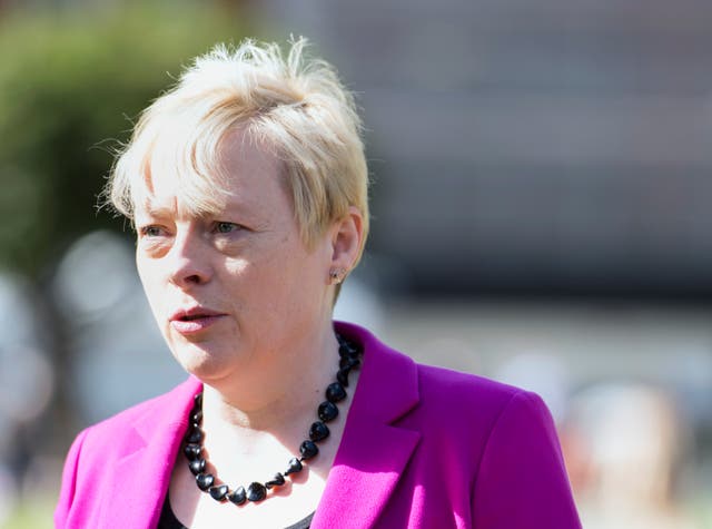 Dame Angela Eagle looks off-camera on a sunny day