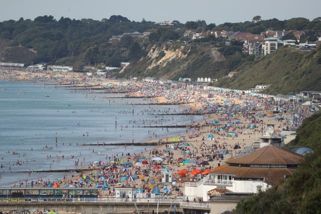 People enjoy the hot weather on Bournemouth beach in Dorset