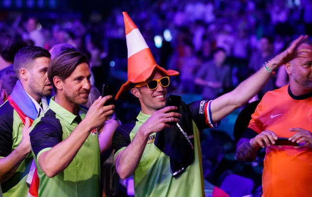 Robin Van Persie, centre, was at the O2 Arena cheering on his compatriot Michael van Gerwen