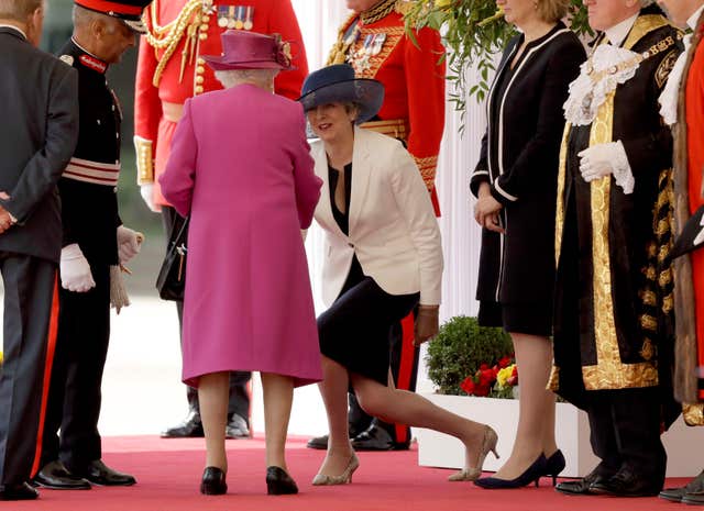 Mrs May displays here trademark low curtsy when greeting the Queen during the start of King Felipe of Spain's state visit to the UK in 2017. (Ben Stansall/PA)