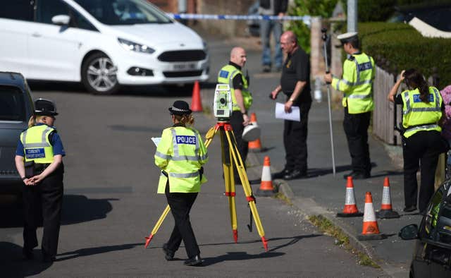 Police survey the scene in Meadow Close after the unlawful killing of Dalian Atkinson