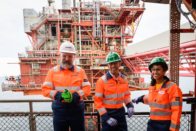 Prime Minister Rishi Sunak, centre, and Energy Security and Net Zero Secretary Claire Coutinho on a gas platform in the North Sea