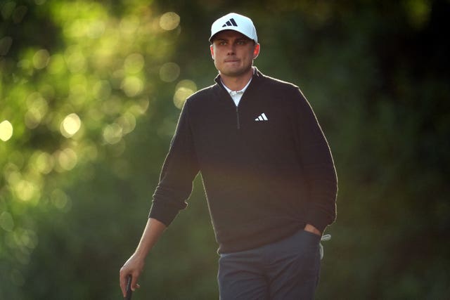 Ludvig Aberg leans on his putter