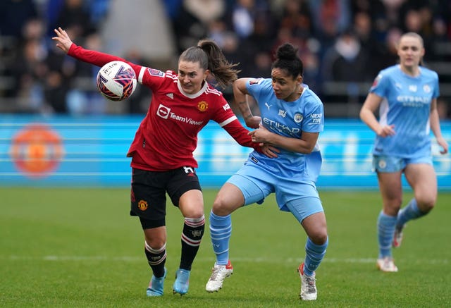 Manchester United's Vilde Boe Risa and Manchester City's Demi Stokes battle for the ball (Nick Potts/PA).