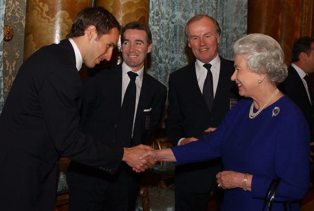 Gareth Southgate (left) shakes hand with the Queen