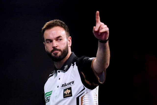 Ross Smith reacts during a match at the PDC World Darts Championship