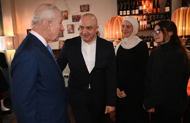 The King with Imad Eddin Al Arnab, Syrian Kitchen founder, as he meets members of the British Syrian community