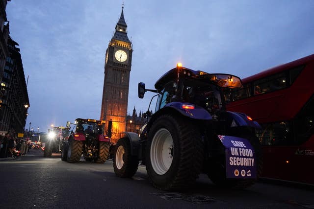 Farmers take part in a tractor 'go-slow' through Parliament Square