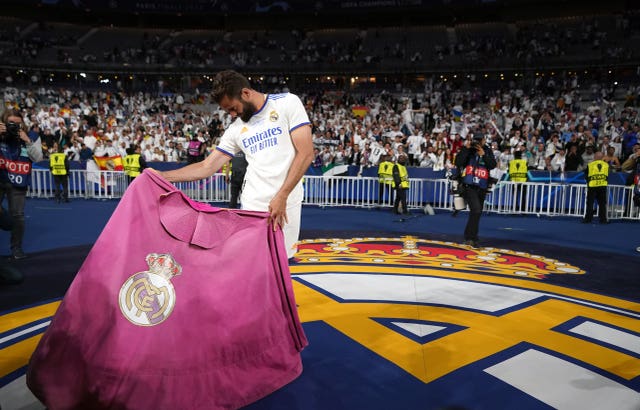 Real Madrid’s Nacho with a matador cape after winning the UEFA Champions League Final at the Stade de France, Paris. Picture date: Saturday May 28, 2022.