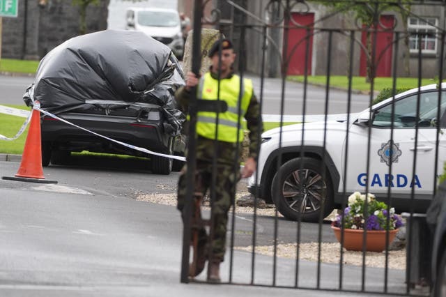 A car wrapped in plastic at the scene at Renmore Barracks (Brian Lawless/PA)