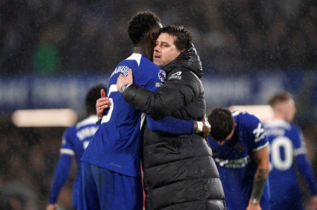 Chelsea manager Mauricio Pochettino, right, celebrates victory over Manchester United with Benoit Badiashile