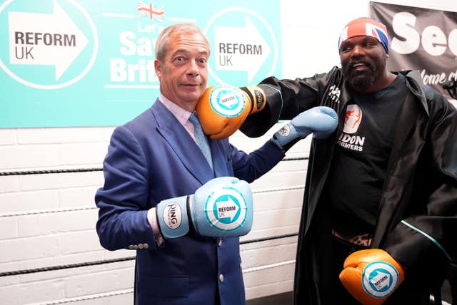 Reform UK leader Nigel Farage (left) and boxer Derek Chisora at a boxing gym in Clacton, Essex, while on the General Election campaign trail 