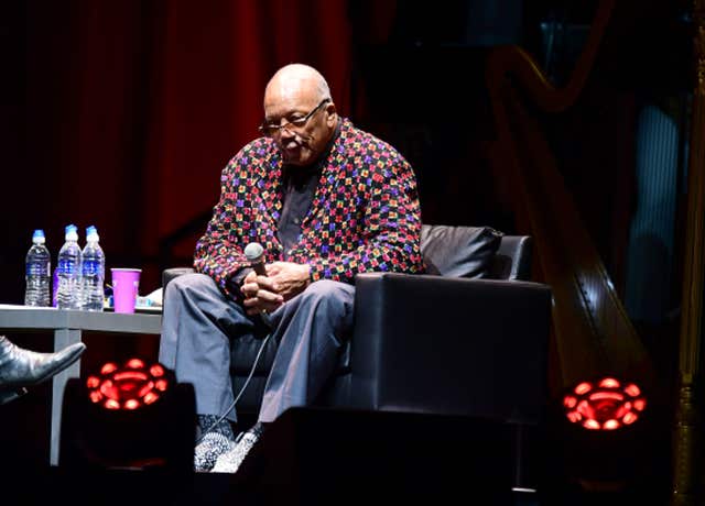 Quincy Jones sitting on stage at The O2