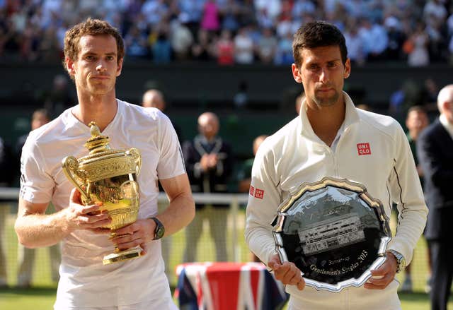 Andy Murray, left, holds the Wimbledon trophy after beating Novak Djokovic in the final in 2013