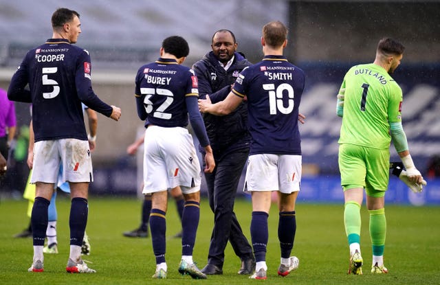 Crystal Palace manager Patrick Vieira (centre) greets the Millwall players on the pitch