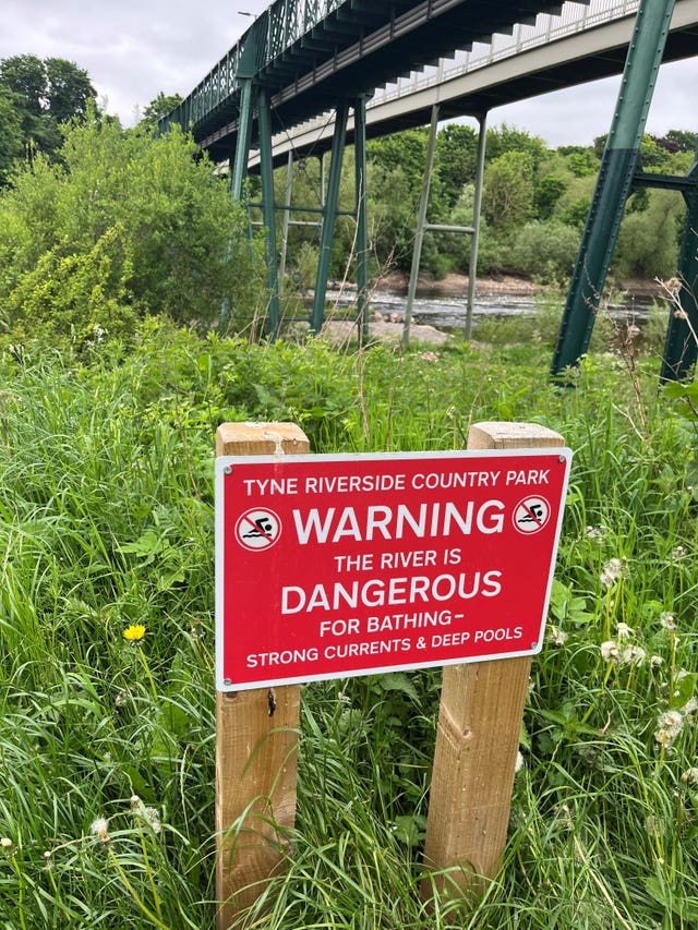 A sign on the opposite Prudhoe side of the River Tyne at Ovingham