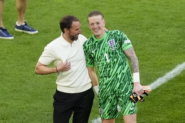 Gareth Southgate celebrates with Jordan Pickford