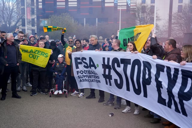 Manchester United fans protest ticket pricing ahead of the Premier League match at Old Trafford