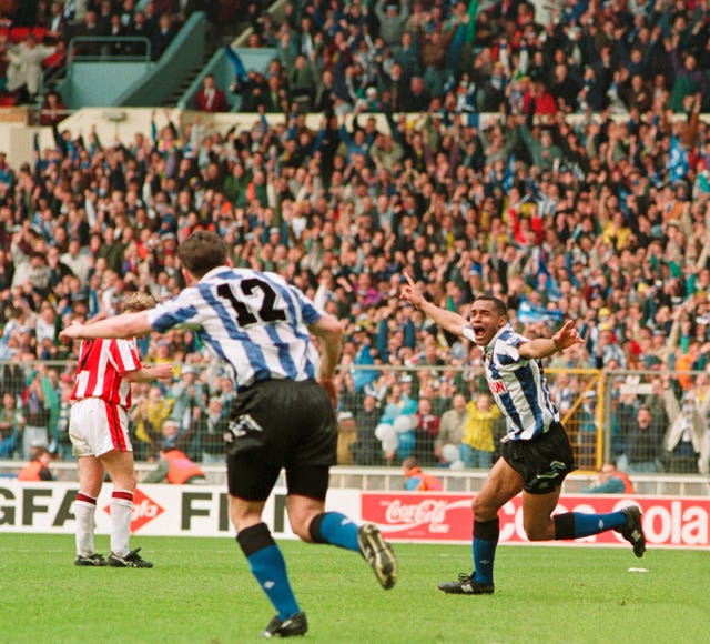 Sheffield Wednesday's Mark Bright (right) after scoring the winner against Sheffield United