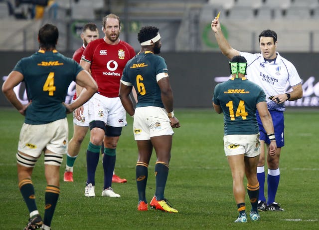 Referee Ben O’Keeffe shows Cheslin Kolbe a yellow card for taking Conor Murray out in the air