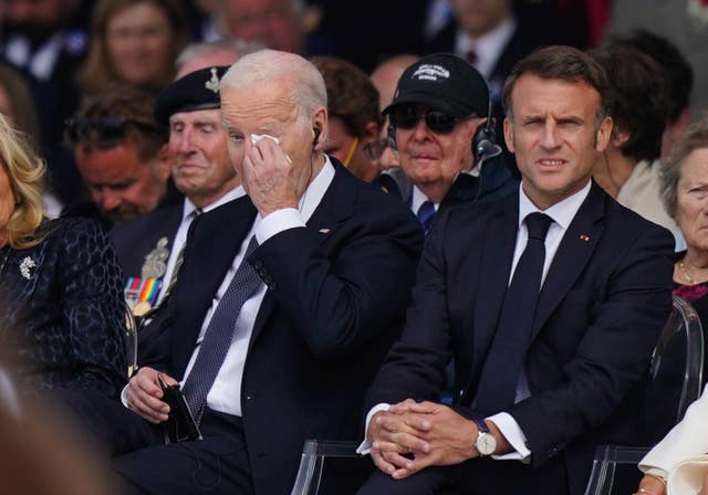 US President Joe Biden wipes his eye during the official international ceremony to mark the 80th anniversary of D-Day, at Omaha Beach in Saint-Laurent-sur-Mer, Normandy, France 