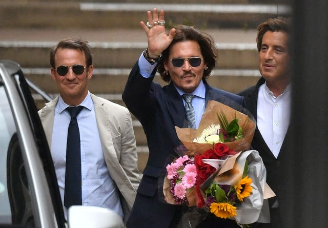 Actor Johnny Depp (centre) is bringing a libel claim against The Sun newspaper (Dominic Lipinski/PA)