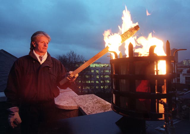 Man lighting a beacon