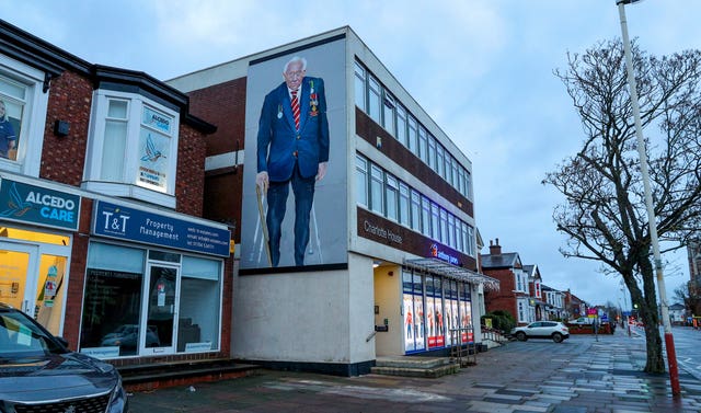 A mural of Captain Sir Tom Moore on a building in Southport (Peter Byrne/PA)