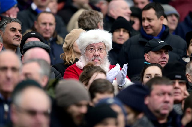 A Chelsea fan dressed as Santa