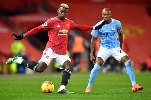 Paul Pogba (left) was back in the starting XI for Manchester United in their Premier League derby