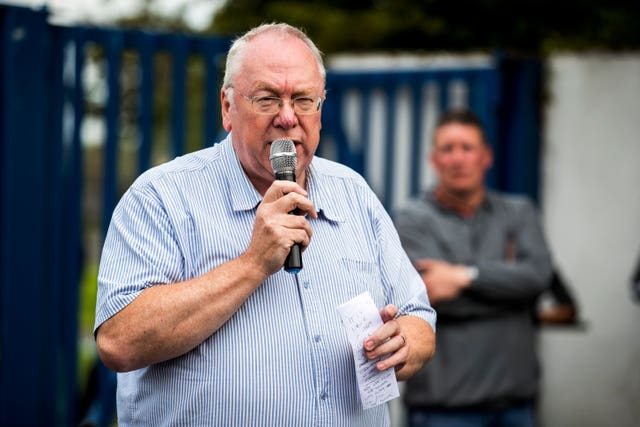 Orange Order grand secretary Mervyn Gibson addresses supporters of the bonfire at Avoniel leisure centre