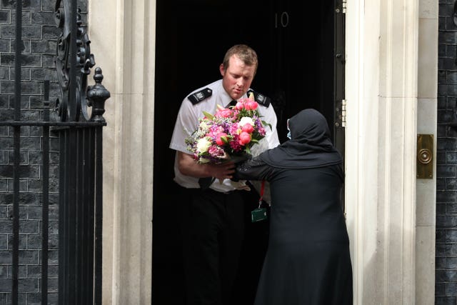 A bouquet of flowers is delivered to Downing Street, London, on behalf of prime minister of Pakistan Imran Khan, after it was announced that Prime Minster Boris Johnson’s fiancee Carrie Symonds had given birth to a baby boy (Yui Mok/PA)