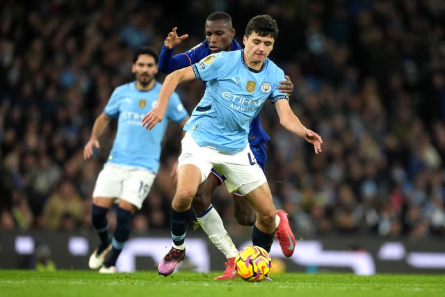 Manchester City’s Abduqodir Khusanov (right) and Chelsea’s Nicolas Jackson battle for the ball 