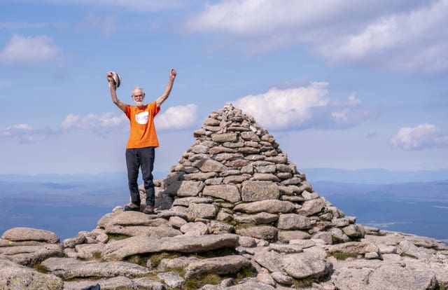 Nick Gardner, aged 82, reaches the very top of his final mountain the Cairn Gorm after setting the goal of climbing all 282 Munros in 1200 days in 2022