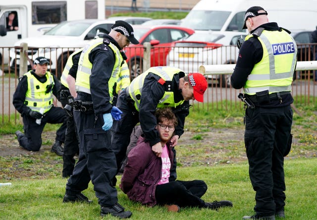 Protesters being detained by police