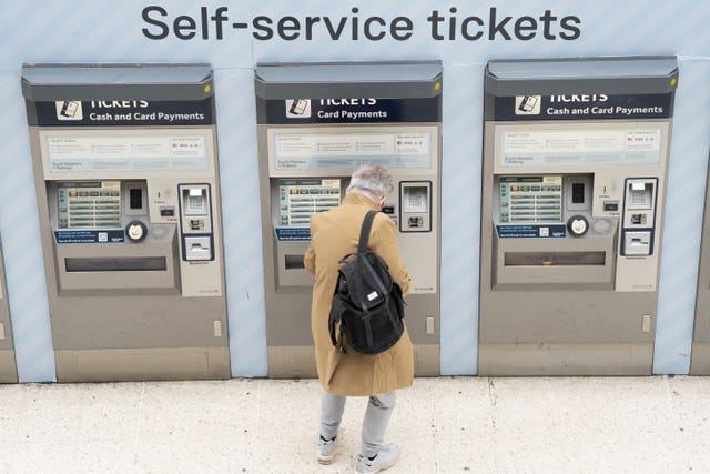 A person using a ticket machine