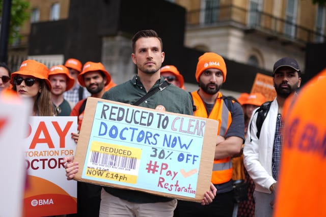 Junior doctors with placards taking industrial action