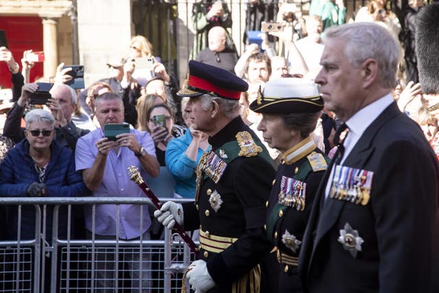 King Charles III, the Princess Royal and the Duke of York join the procession of the Queen’s coffin