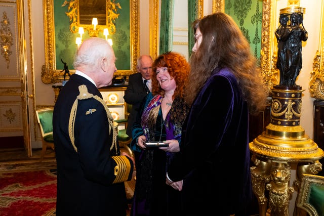 Charles presents an Elizabeth Emblem to Rebecca Lombard-Earl