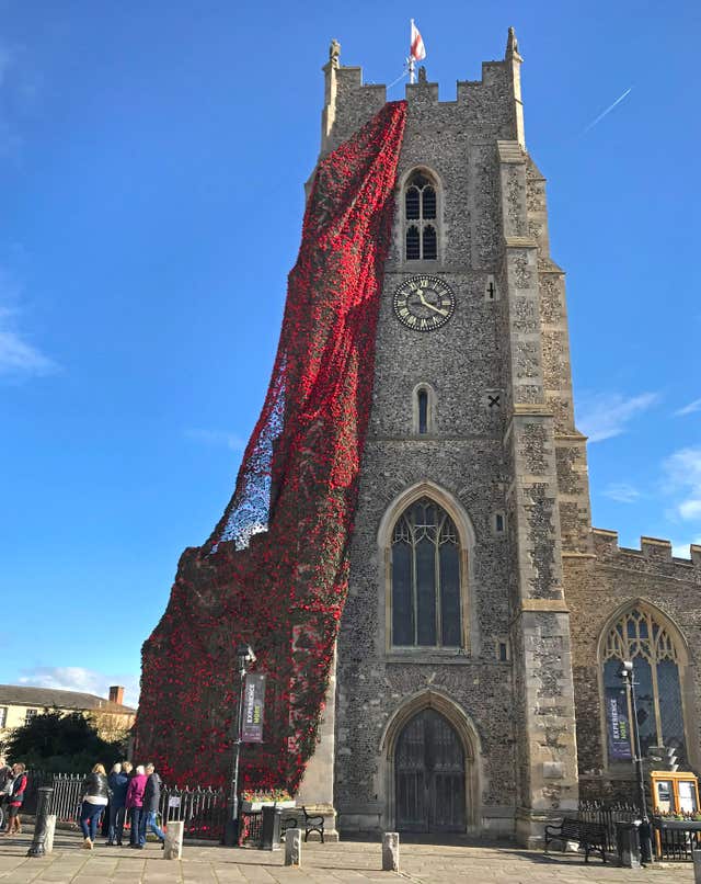 Knitted poppies adorn Sudbury church
