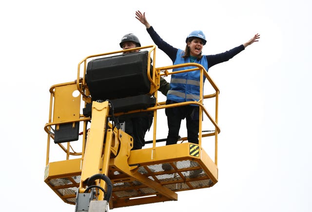 Liberal Democrat leader Jo Swinson on a cherry picker during a visit to an eco home building site in Sheffield