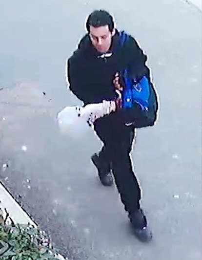 Callum Wheeler walking with a blue holdall taken from CCTV